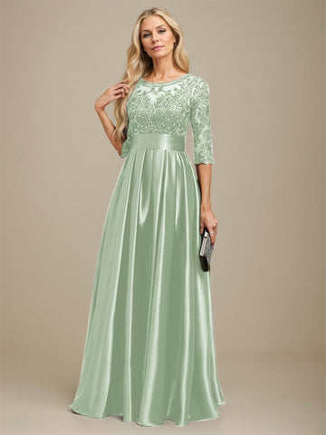 Vestido de madrina de la novia, corte en A, escote ilusión, largo hasta el suelo, satén elástico con encaje y lazo de lentejuelas. 