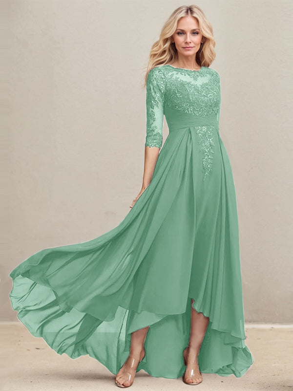 Vestido de madrina de la novia, corte en A, escote redondo ilusión, asimétrico, de encaje y gasa con lentejuelas plisadas. 