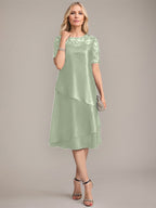 Vestido de corte A, escote redondo, largo hasta la rodilla, para la madre de la novia, con apliques y lentejuelas. 