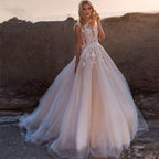 Vestido de novia bohemio de corte A con apliques de encaje y escote redondo, sin mangas, tul ilusión
