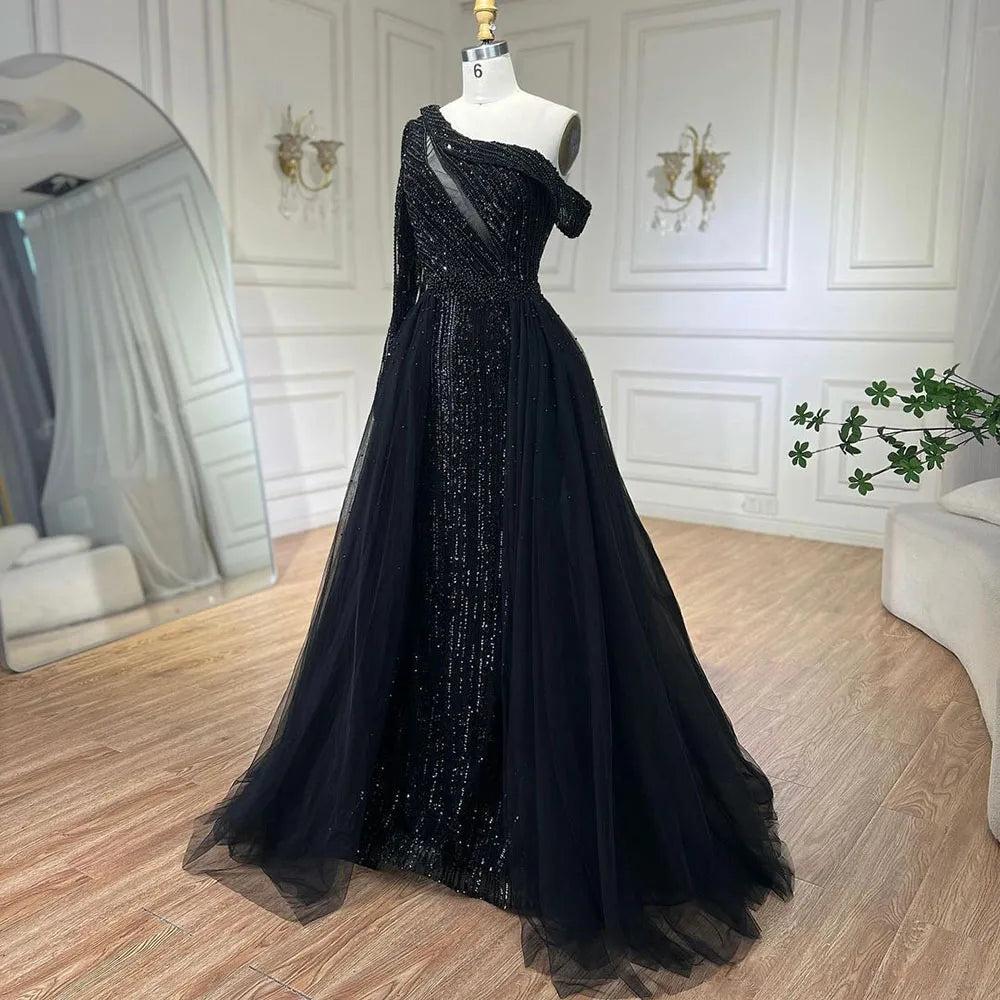 Vestido de noche de lujo negro de un solo hombro con sobrefalda y cuentas, ideal para ocasiones formales y fiestas (modelo LA72424A). 