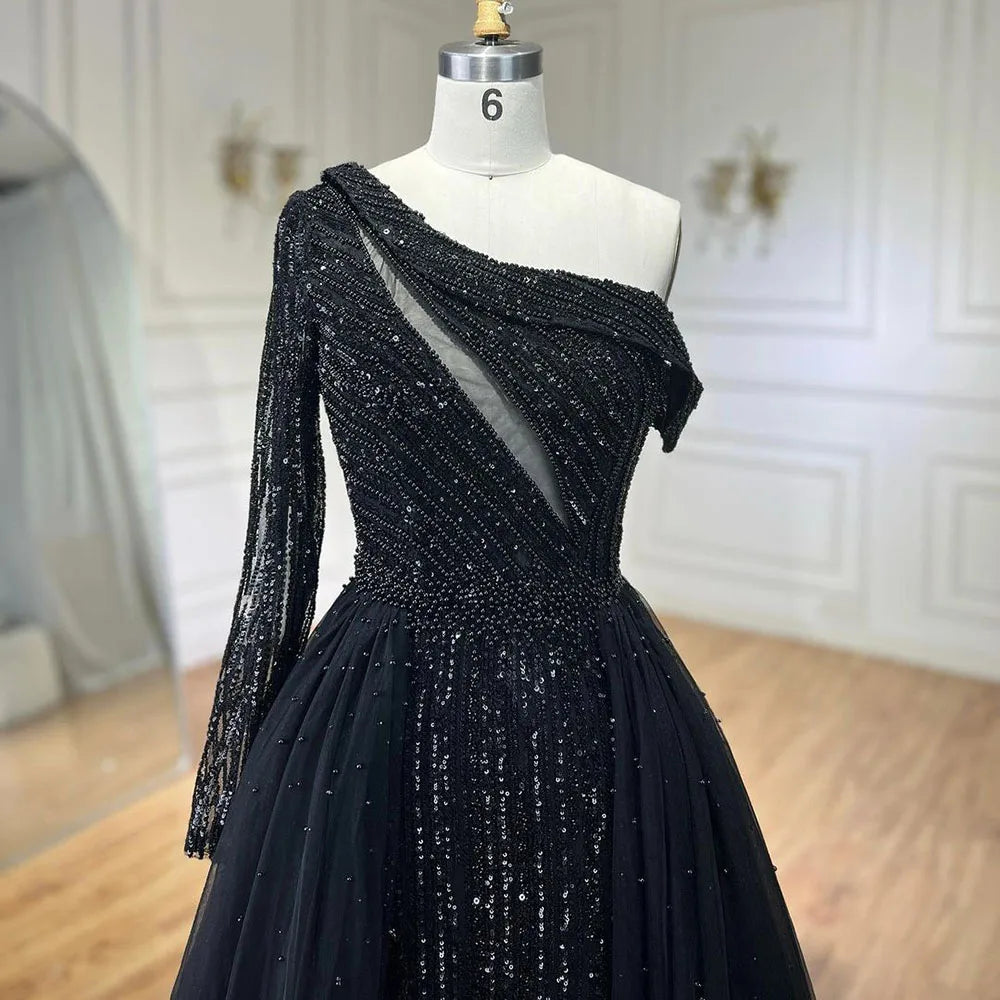 Vestido de noche de lujo negro de un solo hombro con sobrefalda y cuentas, ideal para ocasiones formales y fiestas (modelo LA72424A). 