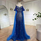 Vestido de noche de lujo estilo sirena azul con tirantes finos y mangas tipo capa, ideal para ocasiones formales (modelo 2025). Fabricado en Arabia Saudita (LA72707). 