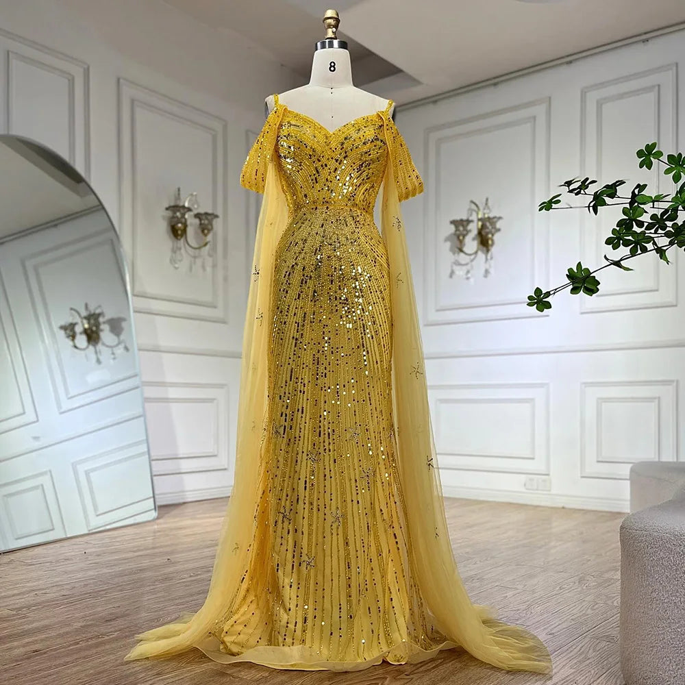 Vestido de noche de lujo estilo sirena azul con tirantes finos y mangas tipo capa, ideal para ocasiones formales (modelo 2025). Fabricado en Arabia Saudita (LA72707). 