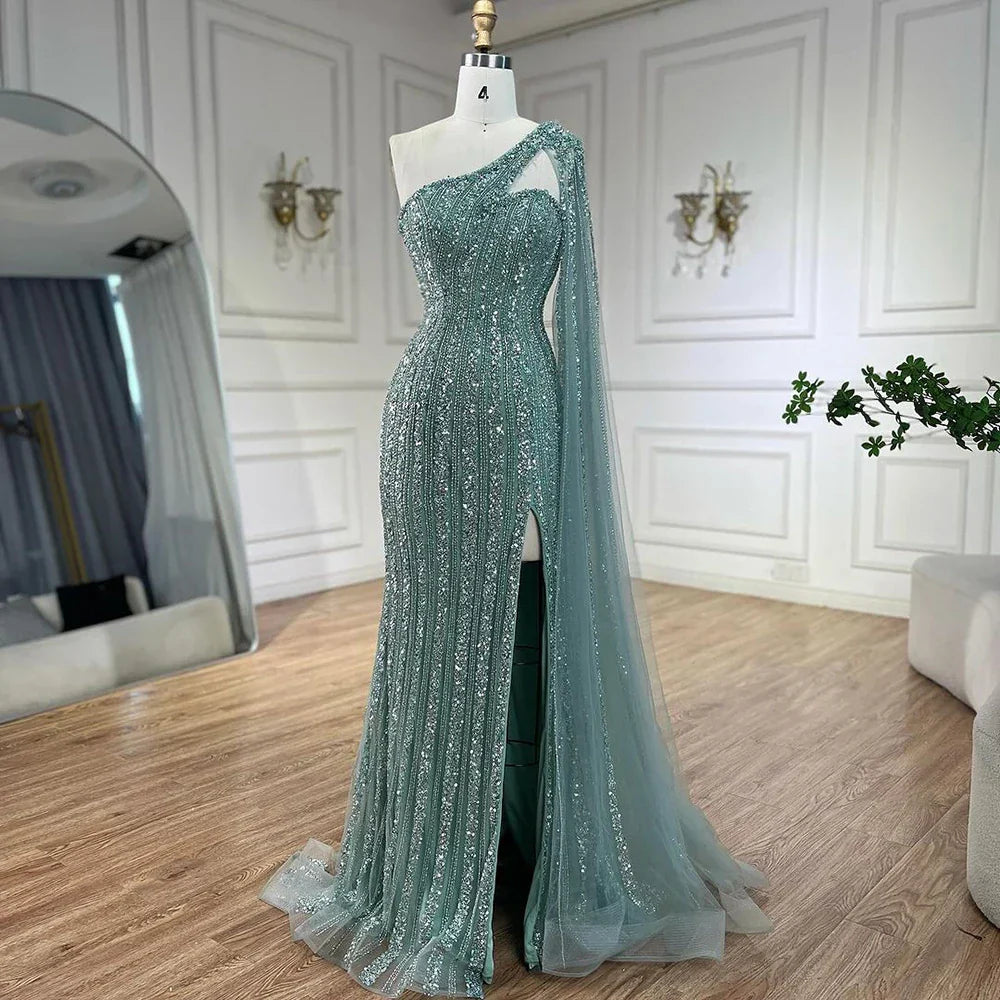 Vestido de noche estilo sirena turquesa con mangas tipo capa, un solo hombro y cuentas árabes, para mujer, ideal para bodas y fiestas (2025) LA72284 