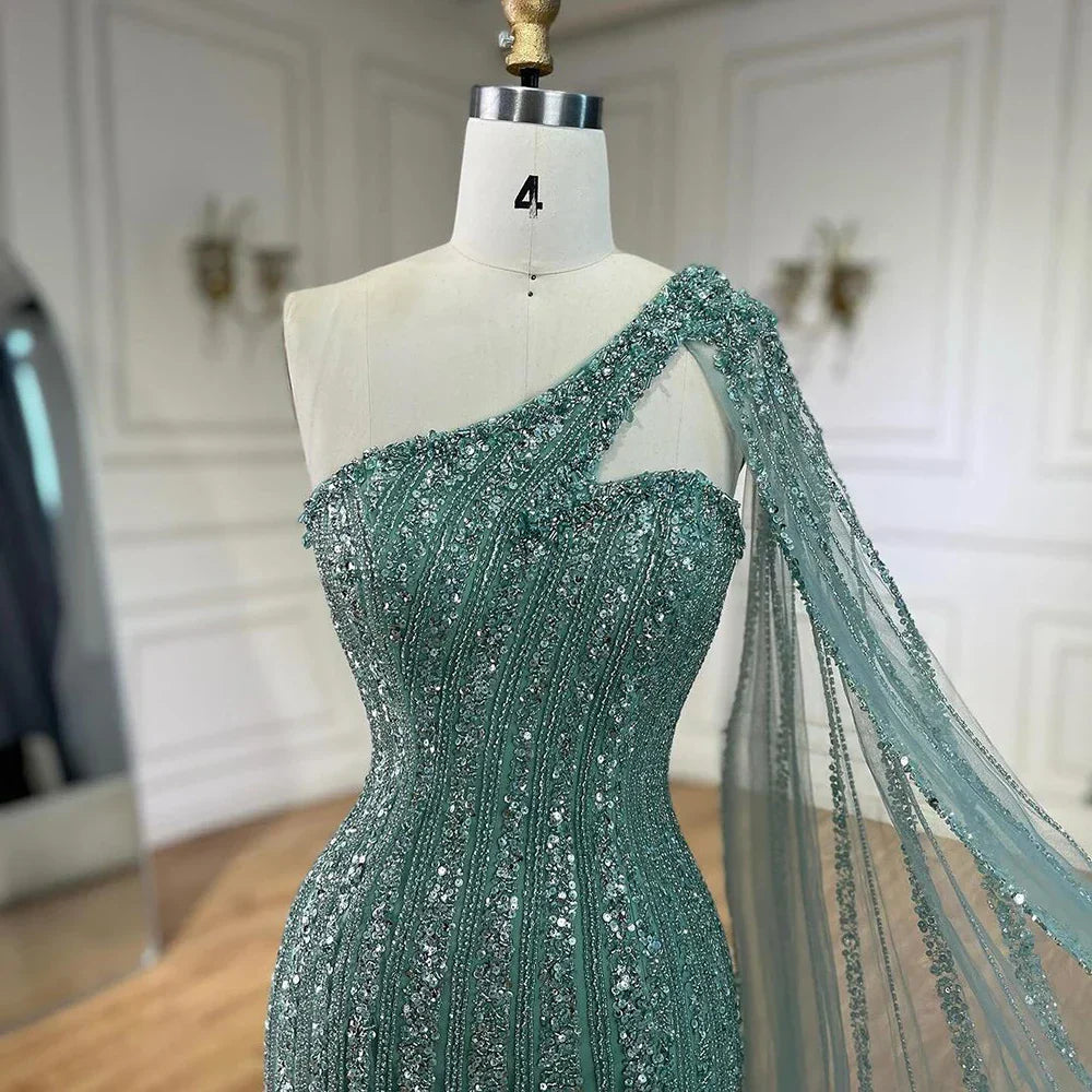 Vestido de noche estilo sirena turquesa con mangas tipo capa, un solo hombro y cuentas árabes, para mujer, ideal para bodas y fiestas (2025) LA72284 