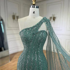 Vestido de noche estilo sirena turquesa con mangas tipo capa, un solo hombro y cuentas árabes, para mujer, ideal para bodas y fiestas (2025) LA72284 
