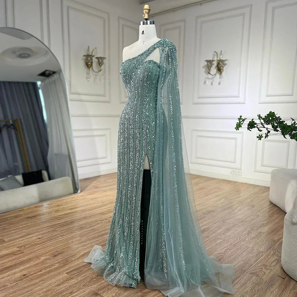 Vestido de noche estilo sirena turquesa con mangas tipo capa, un solo hombro y cuentas árabes, para mujer, ideal para bodas y fiestas (2025) LA72284 