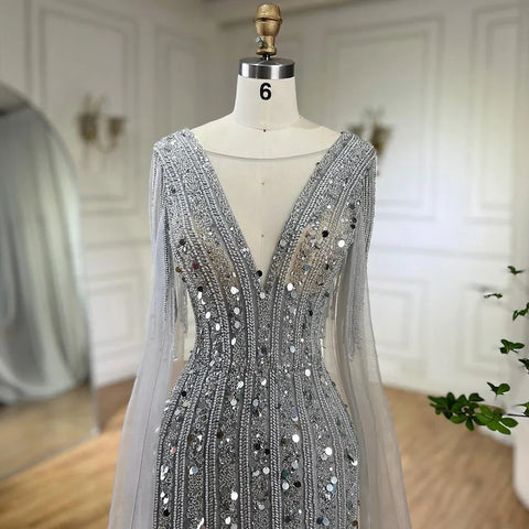 Vestidos de noche elegantes de sirena gris árabe con mangas de capa y lujosos bordados con cuentas para mujer, ideales para bodas y fiestas 2025 LA72289 