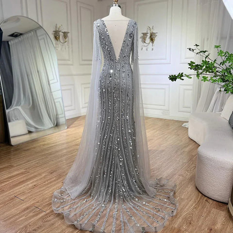 Vestidos de noche elegantes de sirena gris árabe con mangas de capa y lujosos bordados con cuentas para mujer, ideales para bodas y fiestas 2025 LA72289 