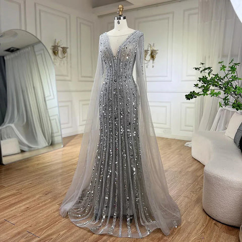 Vestidos de noche elegantes de sirena gris árabe con mangas de capa y lujosos bordados con cuentas para mujer, ideales para bodas y fiestas 2025 LA72289 