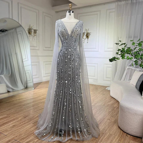 Vestidos de noche elegantes de sirena gris árabe con mangas de capa y lujosos bordados con cuentas para mujer, ideales para bodas y fiestas 2025 LA72289 