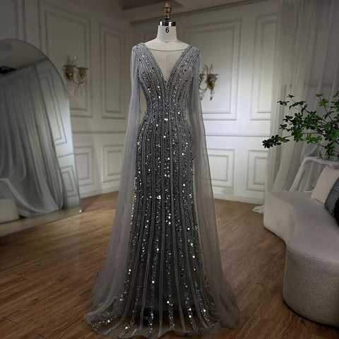 Vestidos de noche elegantes de sirena gris árabe con mangas de capa y lujosos bordados con cuentas para mujer, ideales para bodas y fiestas 2025 LA72289 