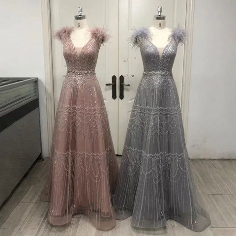 Robe de soirée élégante de luxe rose style arabe, coupe trapèze, ornée de perles et de plumes, pour femme - Mariage 2025 LA72608 