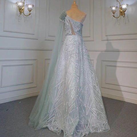 Robe de soirée sexy style arabe turquoise, coupe trapèze, asymétrique, manches cape, perles, luxueuse, 2025, LA71741 