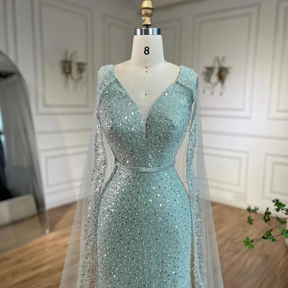 Vestido de noche árabe estilo sirena turquesa estilo Dubái con elegantes mangas de capa con cuentas de lujo para fiesta femenina 2025 LA72574 
