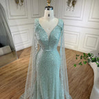 Vestido de noche árabe estilo sirena turquesa estilo Dubái con elegantes mangas de capa con cuentas de lujo para fiesta femenina 2025 LA72574 