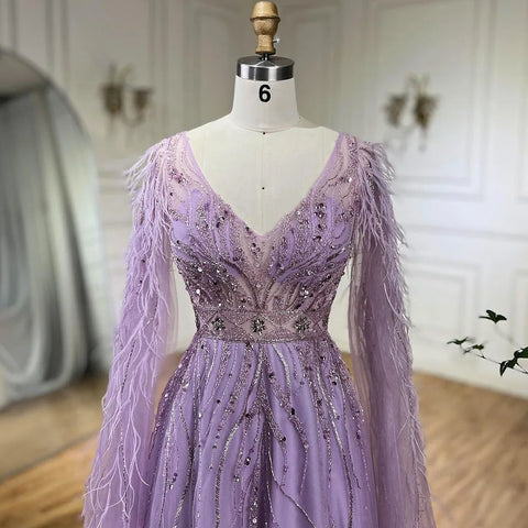 Robe de soirée trapèze couleur chair à plumes et manches cape LA72304