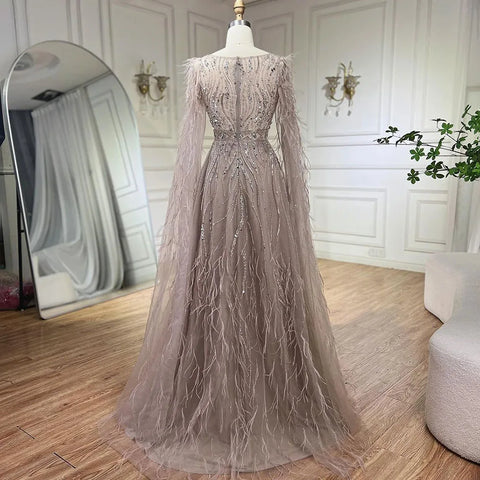 Robe de soirée trapèze couleur chair à plumes et manches cape LA72304