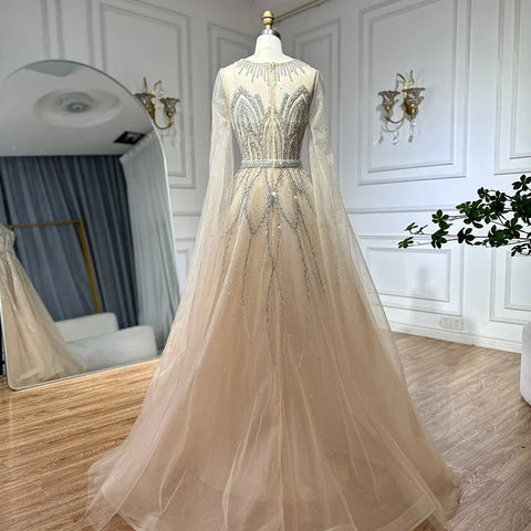 Robe de soirée longue arabe élégante bleu nude, coupe trapèze, perlée, avec manches cape, pour une occasion formelle, LA72785, 2025 