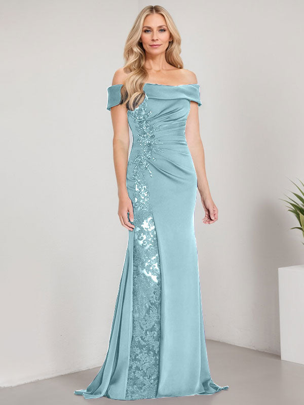 Vestido de corte sirena para la madre de la novia, largo hasta el suelo, con hombros descubiertos, apliques y pedrería, con abertura alta. 