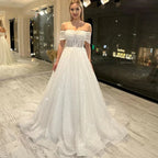Vestidos de novia nuevos con encaje brillante, escote corazón y hombros descubiertos, espalda descubierta, hermosos apliques y cola de barrido. 