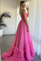 Robe de bal longue fuchsia sans bretelles, corset à volants et tulle à volants