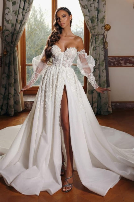 Vestido de novia princesa con escote corazón, cuello alto y mangas abullonadas