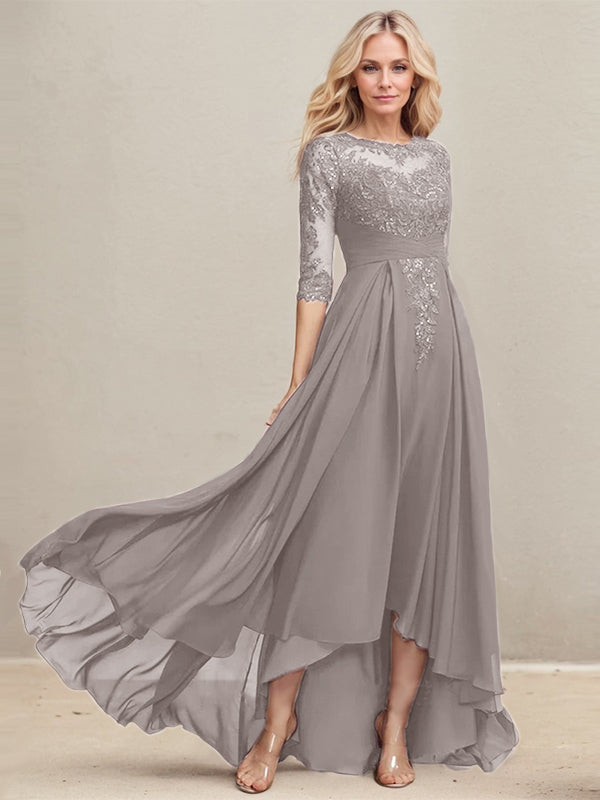 Vestido de madrina de la novia, corte en A, escote redondo ilusión, asimétrico, de encaje y gasa con lentejuelas plisadas. 