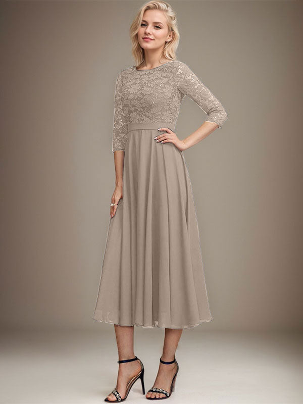 Vestido de novia de corte línea A, escote redondo, largo hasta la rodilla, de encaje y gasa con lentejuelas.