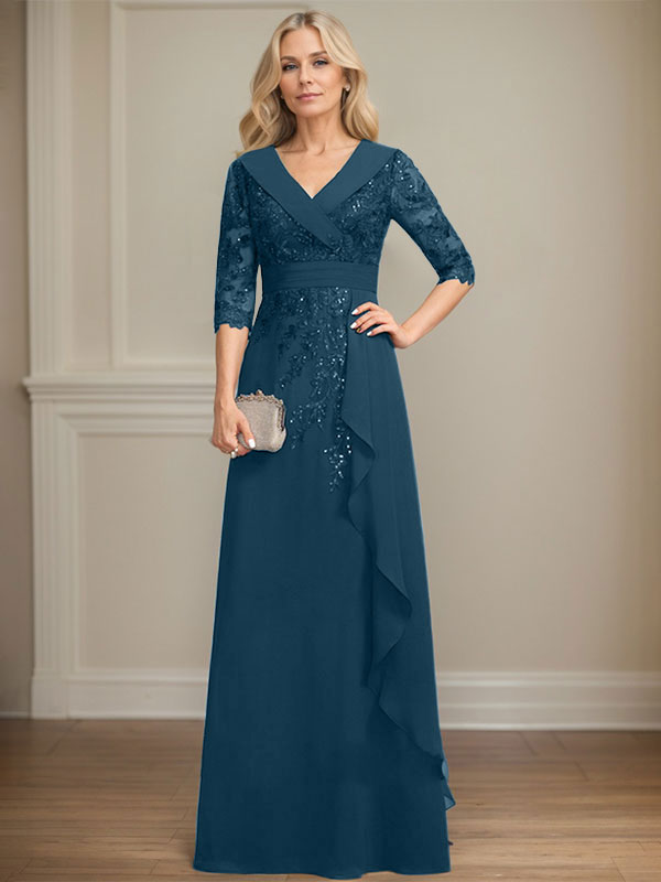 Vestido de novia de corte línea A, cuello en V, largo hasta el suelo, de encaje y gasa, con lentejuelas y volantes en cascada. 