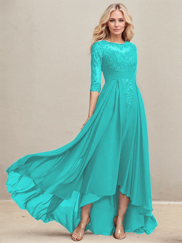 Vestido de madrina de la novia, corte en A, escote redondo ilusión, asimétrico, de encaje y gasa con lentejuelas plisadas. 