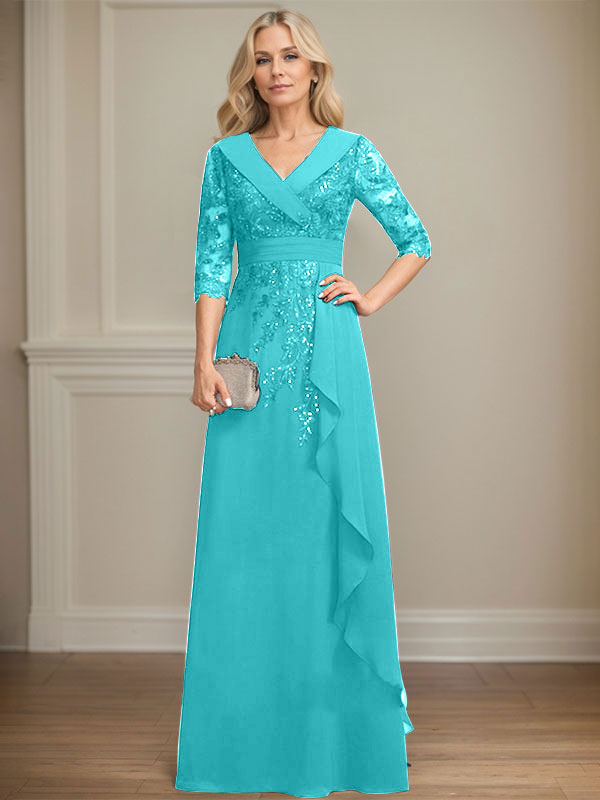 Vestido de novia de corte línea A, cuello en V, largo hasta el suelo, de encaje y gasa, con lentejuelas y volantes en cascada. 