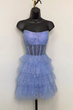 Robe de bal bustier en tulle à volants et corset à sequins
