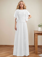 Vestido de novia de corte A, escote redondo, ilusión, largo hasta el suelo, de encaje y gasa con lentejuelas. 