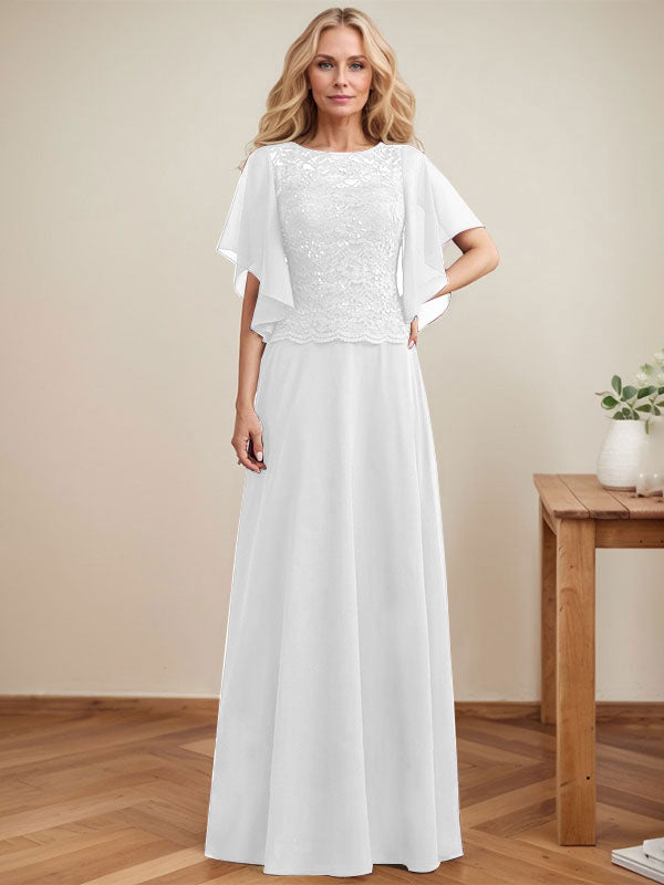 Vestido de novia de corte A, escote redondo, ilusión, largo hasta el suelo, de encaje y gasa con lentejuelas. 