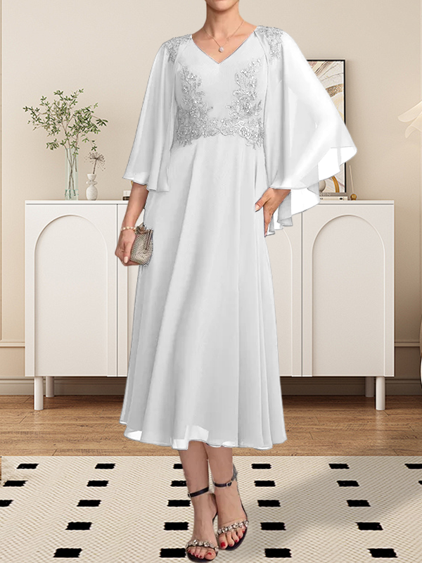 Vestido de corte A, escote en V, largo hasta la rodilla, de gasa, encaje, con lentejuelas y pedrería para la madre de la novia.