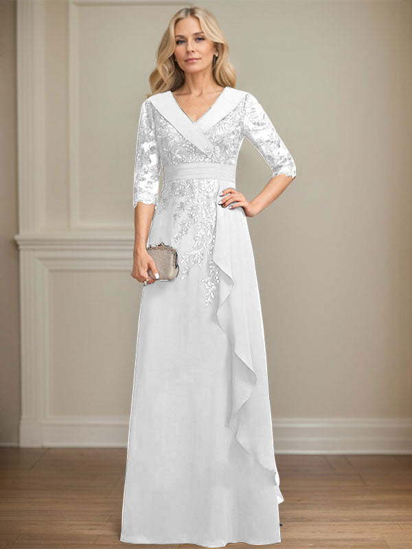 Vestido de novia de corte línea A, cuello en V, largo hasta el suelo, de encaje y gasa, con lentejuelas y volantes en cascada. 