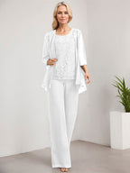 Vestido de novia de gasa con encaje y lentejuelas, estilo mono/pantalón, largo hasta el suelo, con escote redondo.