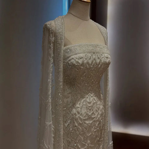 Vestido de noche de lujo con capa larga de sirena blanca, estilo Dubái, Arabia Saudita, con abalorios, para ocasiones formales (2025, LA72870)