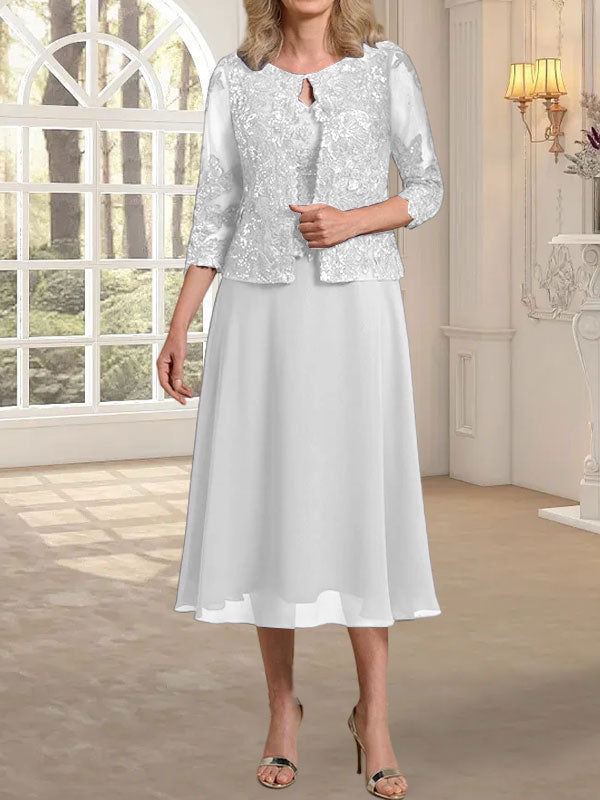 Vestido de novia de corte línea A, escote redondo, largo hasta la rodilla, de encaje y gasa con lentejuelas. 