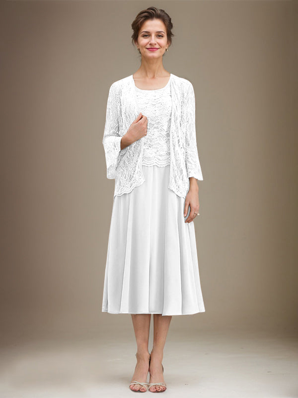 Vestido de novia de corte línea A, escote redondo, largo hasta la rodilla, de encaje y gasa con lentejuelas. 