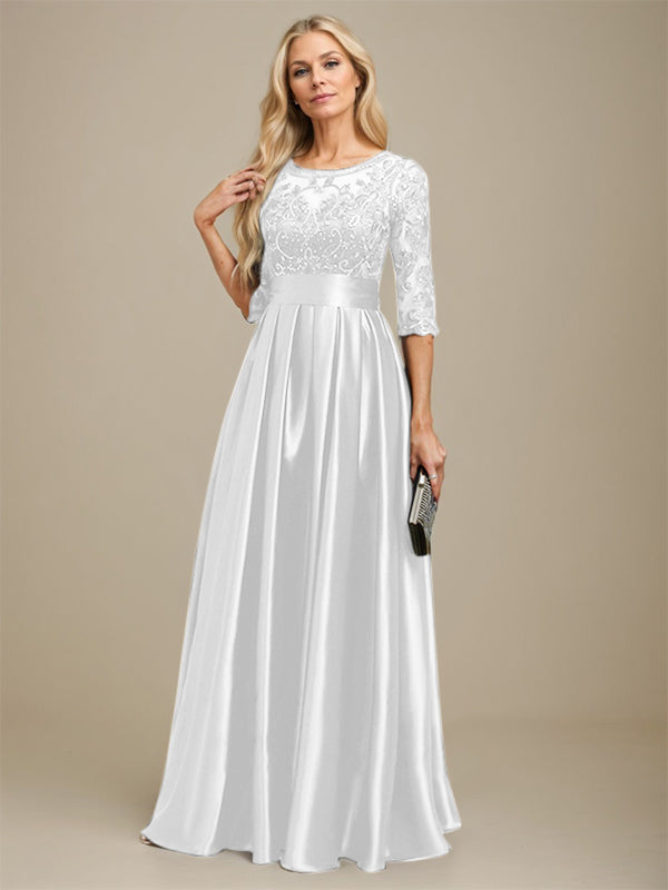 Robe de mariée longue en satin stretch dentelle et dentelle, coupe trapèze, décolleté illusion, ornée d'un nœud à sequins 