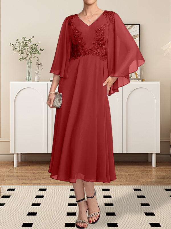 Vestido de corte A, escote en V, largo hasta la rodilla, de gasa, encaje, con lentejuelas y pedrería para la madre de la novia.