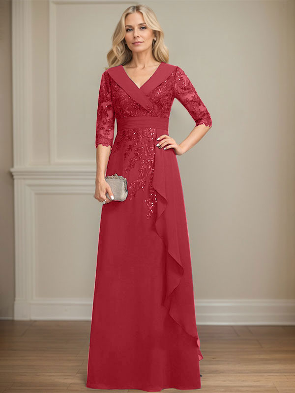 Vestido de novia de corte línea A, cuello en V, largo hasta el suelo, de encaje y gasa, con lentejuelas y volantes en cascada. 