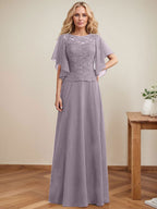 Vestido de novia de corte A, escote redondo, ilusión, largo hasta el suelo, de encaje y gasa con lentejuelas. 