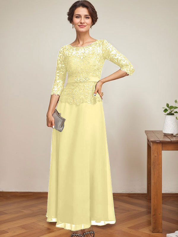 Vestido de novia corte A, escote redondo ilusión, largo hasta el tobillo, de gasa y encaje, con pedrería y detalles de diamantes de imitación. 