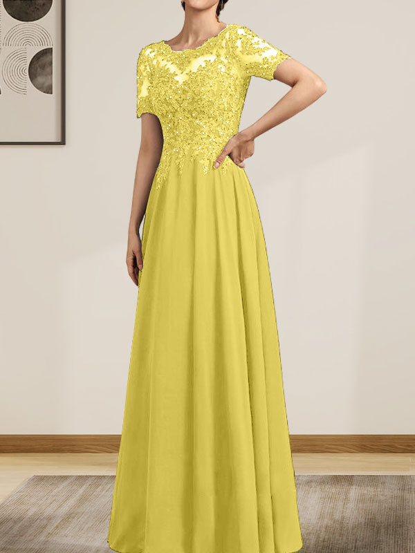 Vestido de corte A, escote ilusión, largo hasta el suelo, de gasa y encaje, con lentejuelas y pedrería, para la madre de la novia.