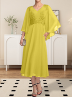 Vestido de corte A, escote en V, largo hasta la rodilla, de gasa, encaje, con lentejuelas y pedrería para la madre de la novia.