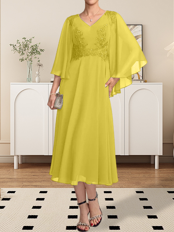 Vestido de corte A, escote en V, largo hasta la rodilla, de gasa, encaje, con lentejuelas y pedrería para la madre de la novia.